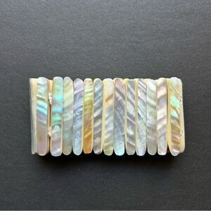 Colorful expandable bracelet. Looks & feels like seashell material.